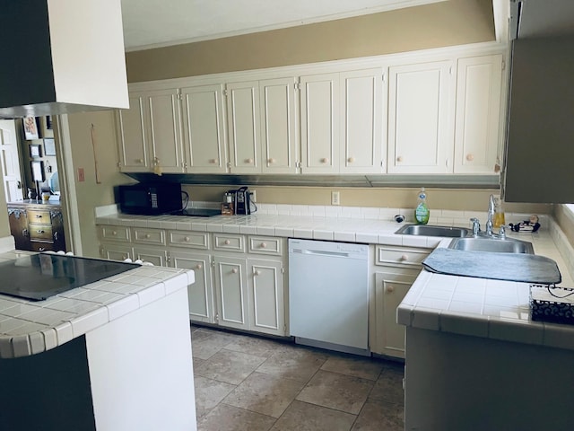 kitchen with kitchen peninsula, white cabinets, sink, dishwasher, and tile counters