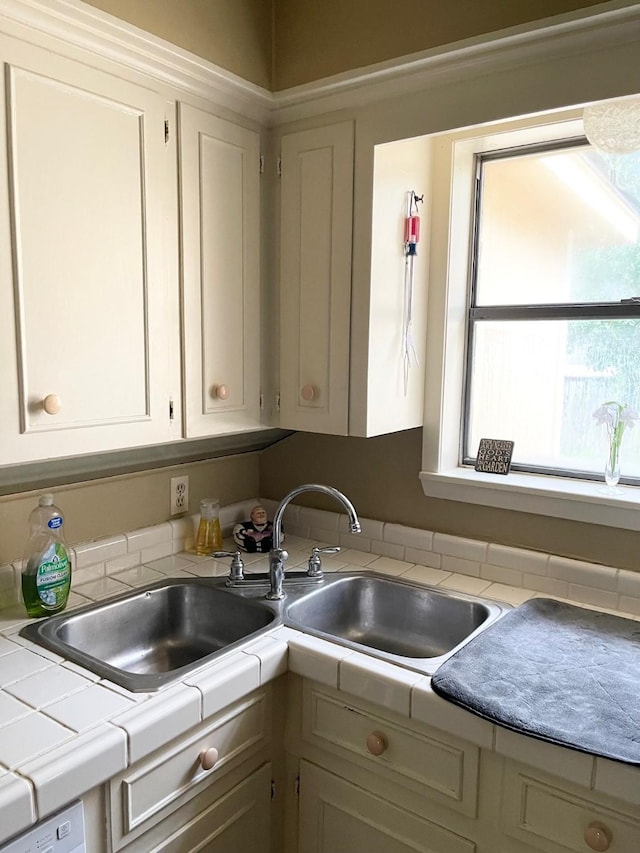 kitchen with tile countertops and sink