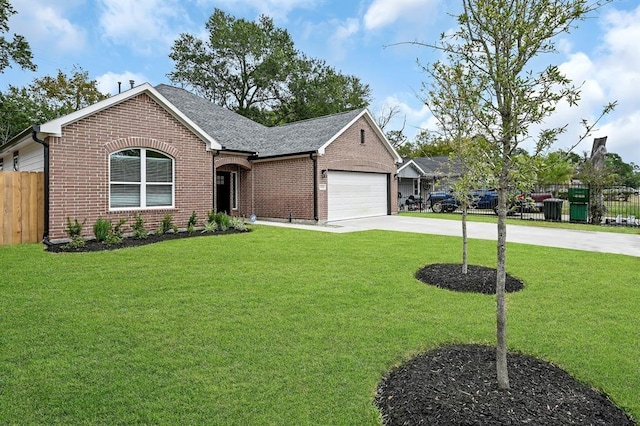 view of front of home featuring a garage and a front lawn