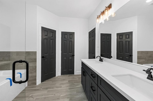 bathroom featuring a bathing tub and vanity