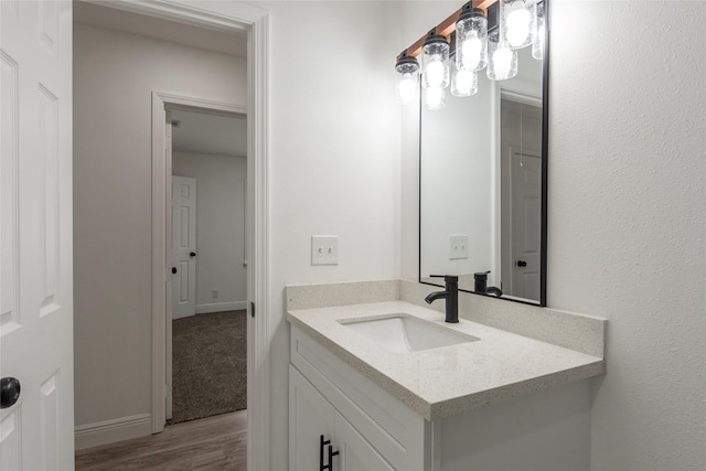 bathroom featuring vanity and hardwood / wood-style flooring