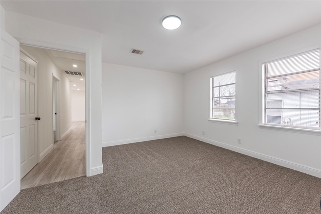 unfurnished room with carpet flooring