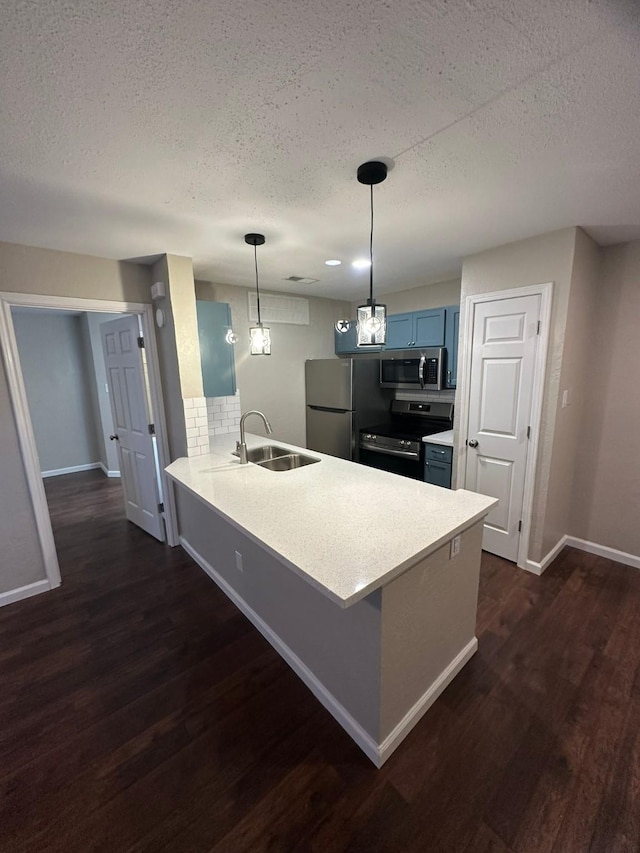 kitchen with kitchen peninsula, stainless steel appliances, dark hardwood / wood-style floors, and sink