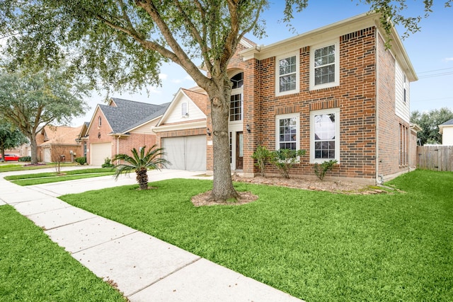 view of front of home featuring a front yard and a garage