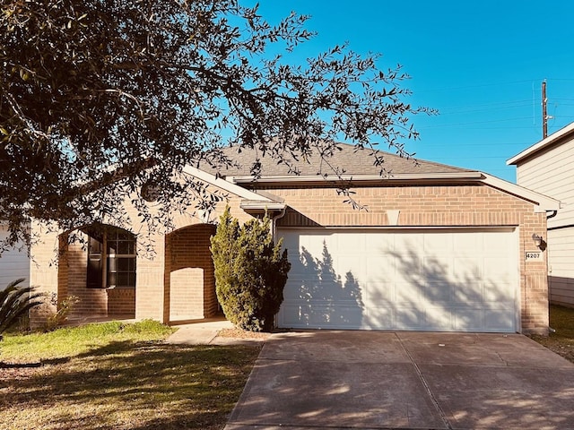 view of front of property with a garage