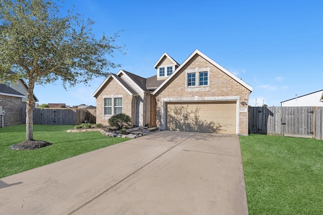 view of front of house featuring a garage and a front lawn