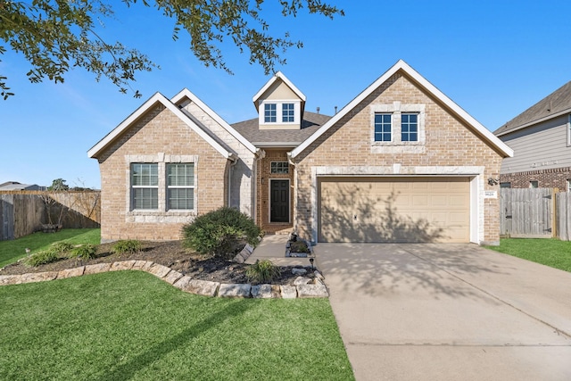 view of front of house with a front yard and a garage