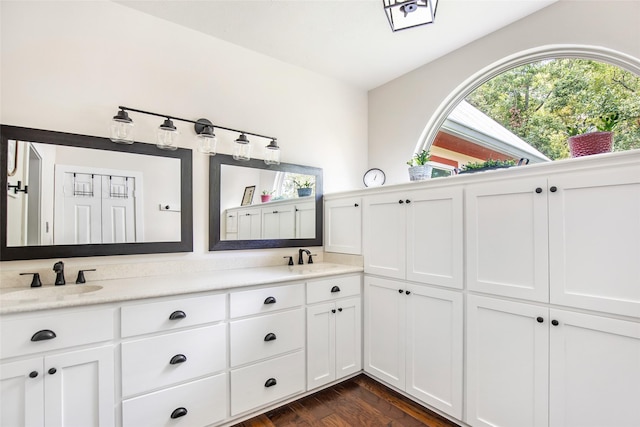 bathroom featuring vanity and hardwood / wood-style flooring