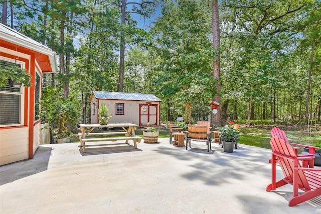 view of patio with a storage unit