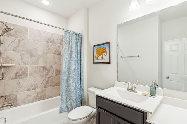 full bathroom with vanity, toilet, and shower / tub combo with curtain