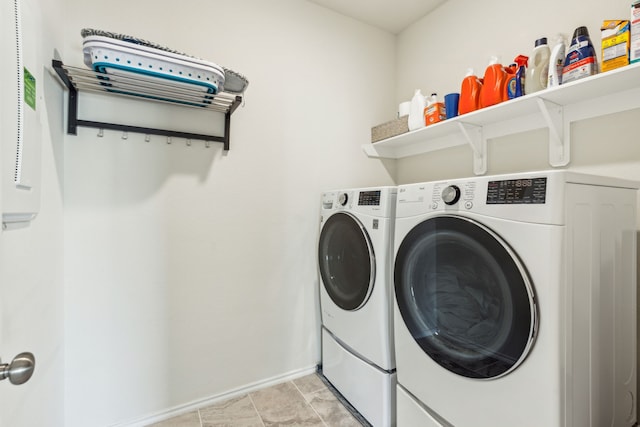 washroom with washing machine and dryer