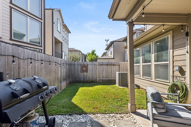 view of yard featuring cooling unit and a patio area