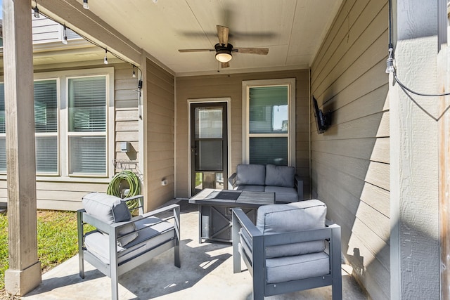 view of patio / terrace with ceiling fan and an outdoor living space