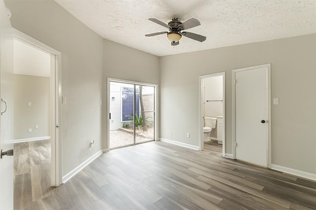 unfurnished bedroom featuring connected bathroom, a textured ceiling, hardwood / wood-style flooring, ceiling fan, and access to exterior