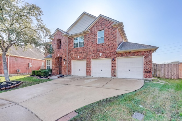 view of front of property with a front yard and a garage