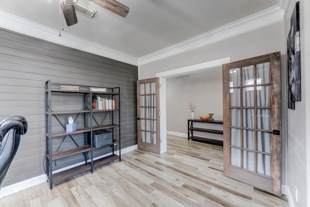 office featuring ceiling fan, french doors, crown molding, and light hardwood / wood-style flooring