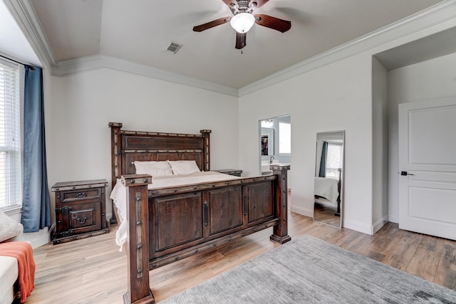 bedroom with ceiling fan, light wood-type flooring, and ornamental molding