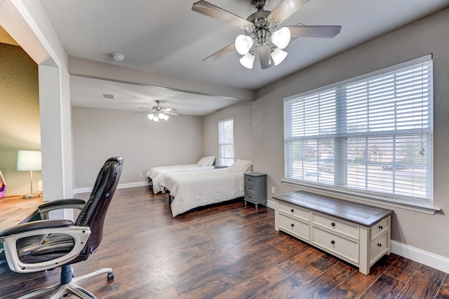 bedroom featuring ceiling fan and dark wood-type flooring