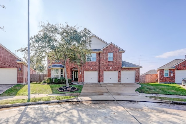 view of front of property featuring a front lawn and a garage