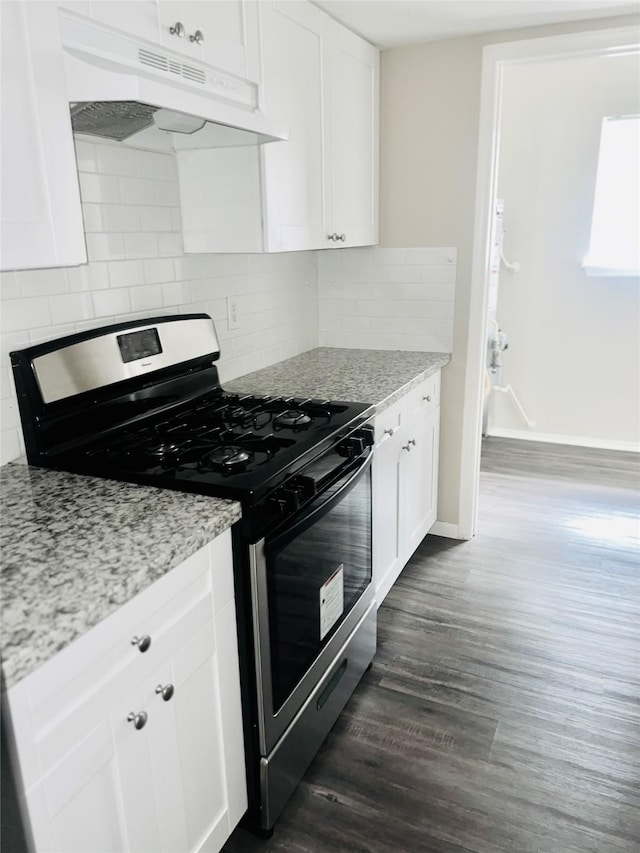 kitchen featuring decorative backsplash, light stone countertops, dark hardwood / wood-style flooring, white cabinetry, and stainless steel range with gas stovetop