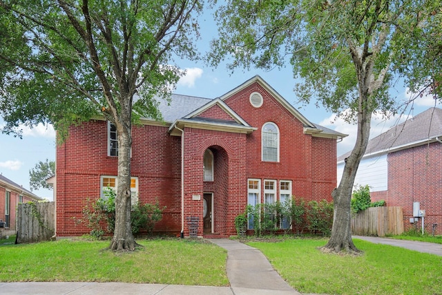 front facade with a front yard