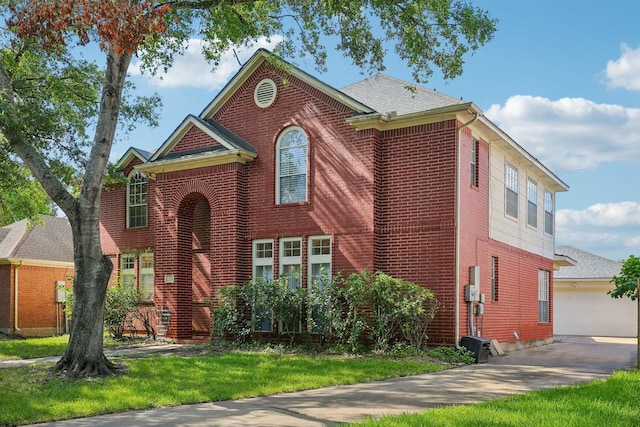 view of front of house with a front yard and a garage