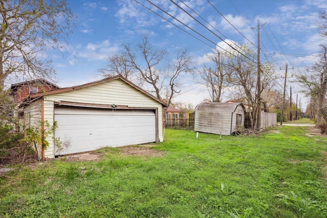 garage featuring a lawn