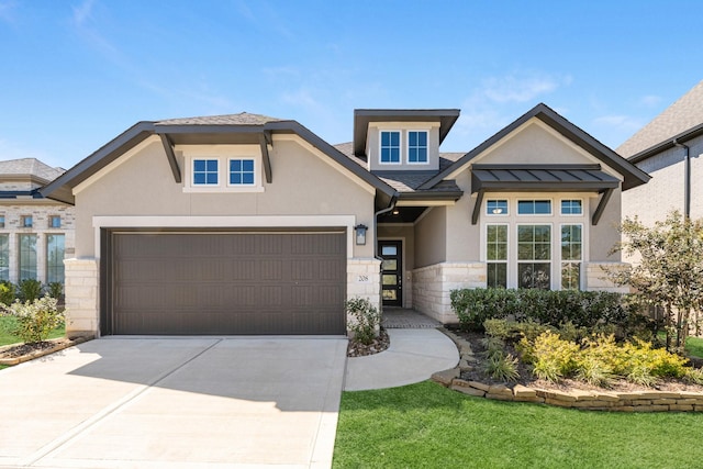 view of front facade with a front yard and a garage