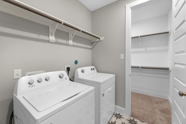 washroom featuring washer and dryer and light colored carpet