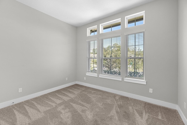 empty room featuring carpet flooring