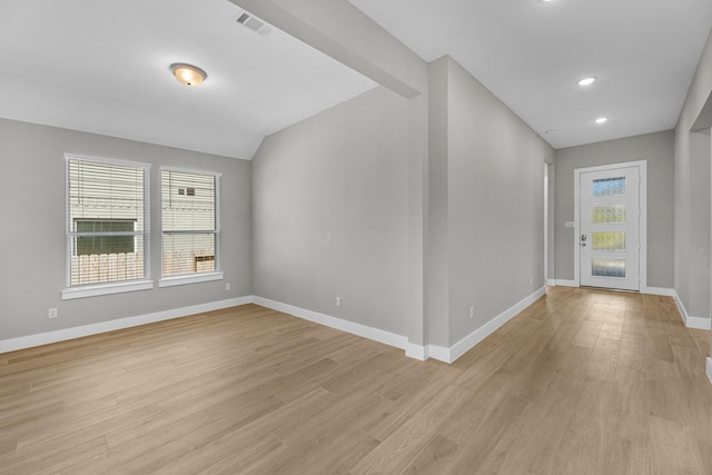 interior space with light hardwood / wood-style floors and a healthy amount of sunlight