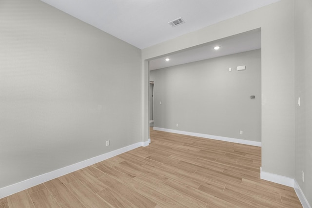 unfurnished room with light wood-type flooring