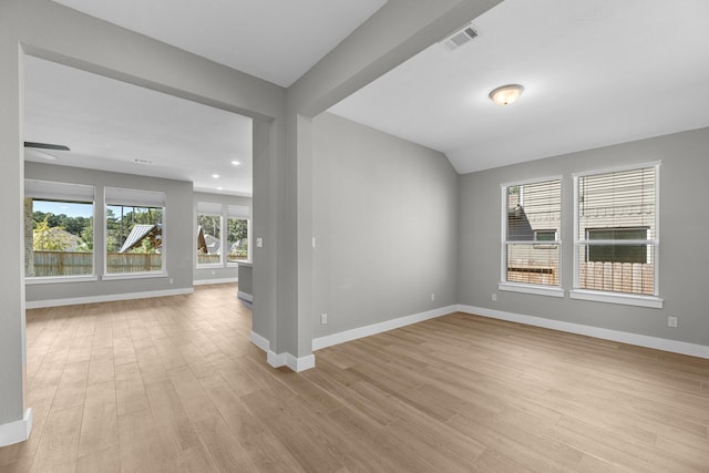 empty room with light hardwood / wood-style flooring