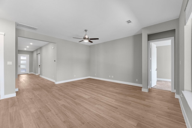 empty room featuring ceiling fan and light hardwood / wood-style flooring