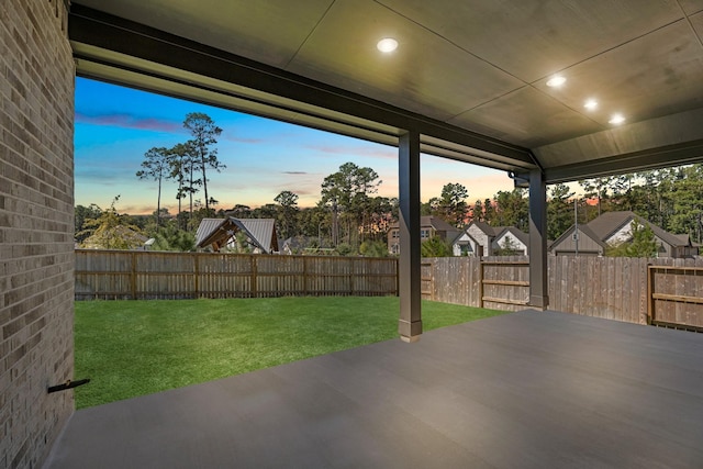 patio terrace at dusk with a lawn