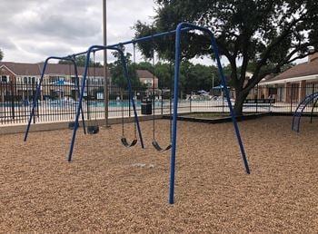 view of property's community with a playground