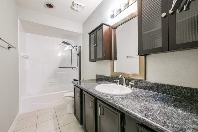 full bathroom featuring tile patterned floors, vanity, bathing tub / shower combination, and toilet