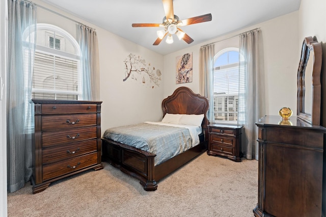 bedroom featuring ceiling fan and light colored carpet