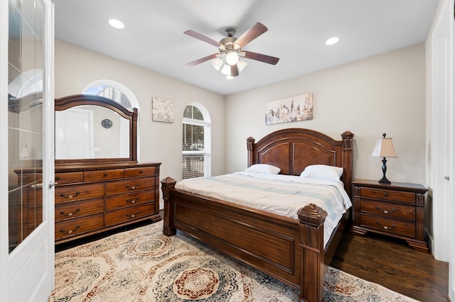 bedroom featuring dark hardwood / wood-style flooring and ceiling fan