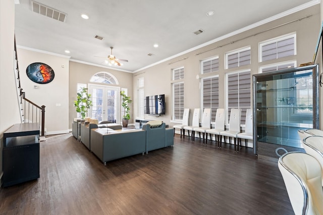 living room featuring ceiling fan, french doors, dark hardwood / wood-style floors, and ornamental molding