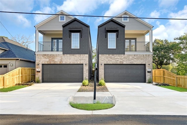 view of front of property with a balcony and a garage