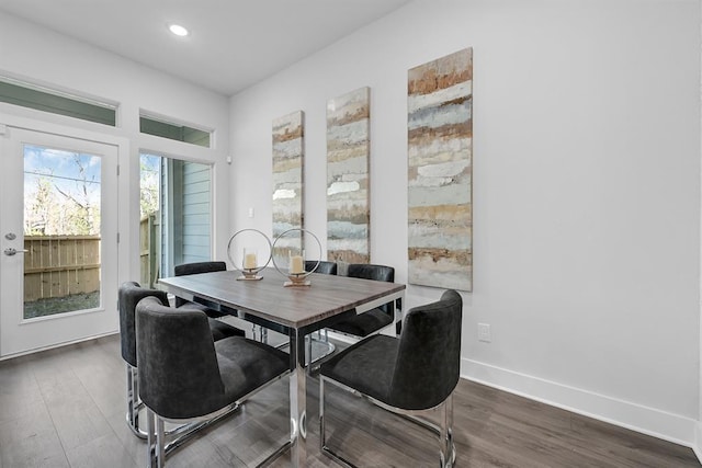 dining space featuring dark hardwood / wood-style floors