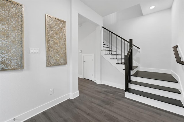 stairs with wood-type flooring