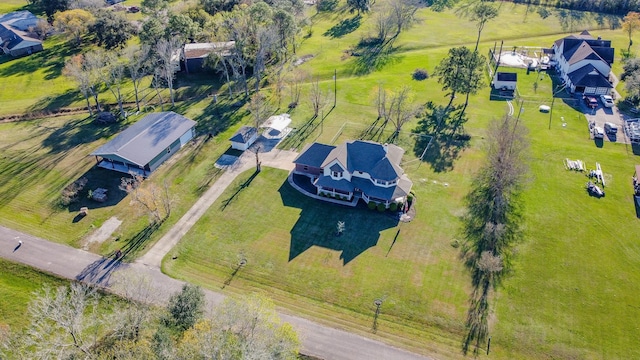 birds eye view of property featuring a rural view