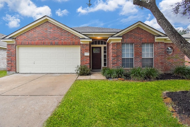 view of front of home featuring a garage and a front yard