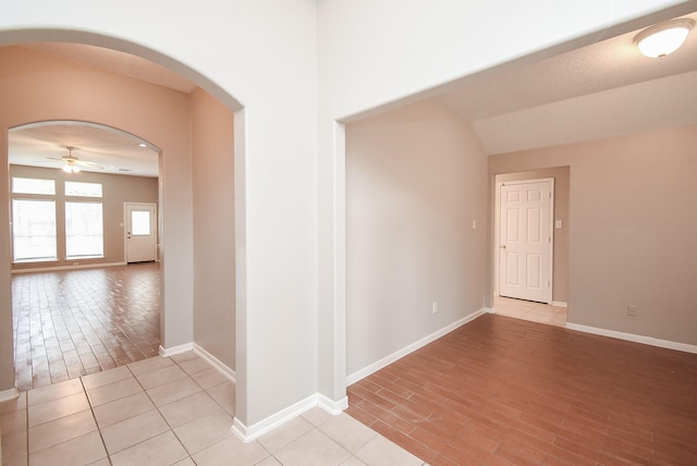 hall with light tile patterned floors