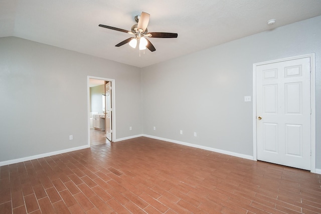 spare room featuring ceiling fan and lofted ceiling