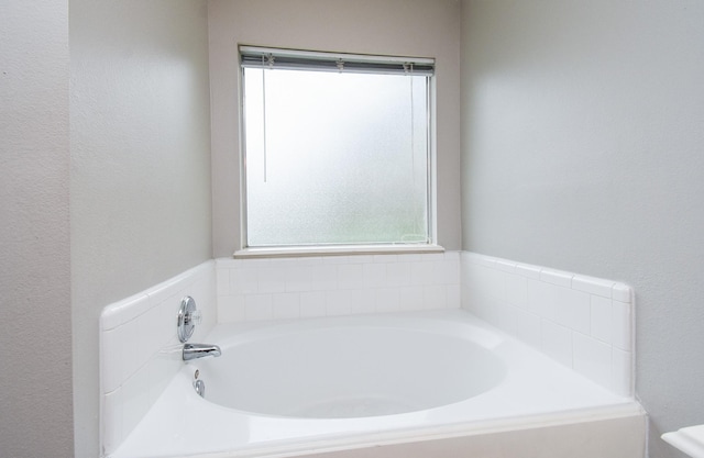 bathroom featuring a washtub