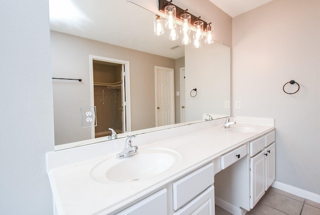 bathroom featuring tile patterned floors and vanity