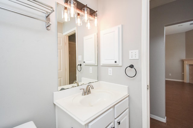 bathroom with vanity and hardwood / wood-style flooring